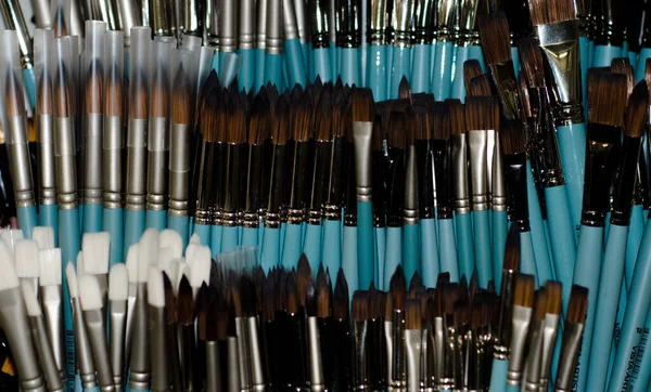 On  shop window-a variety of brushes for artists. Products for creativity. Drawing with paints. Russia. Krasnoyarsk. January 4, 2021