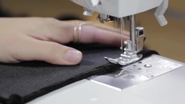 Womans hands with dress at sewing machine — Stock Video