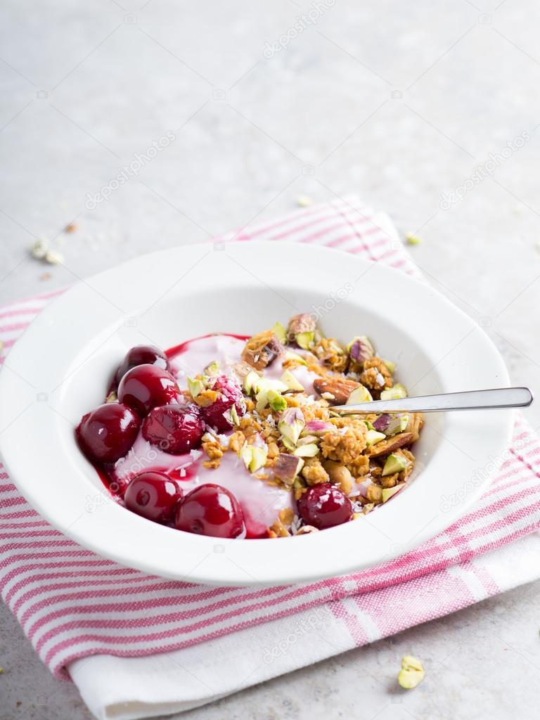 Granola with yogurt and cherry