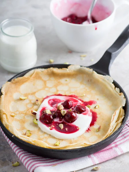 French crepes with yogurt and cherry — Stock Photo, Image