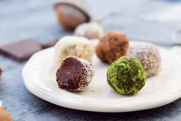 Chocolate truffles on white dish — Stock Photo, Image