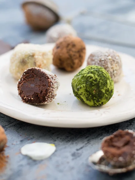 Chocolate truffles on white dish — Stock Photo, Image