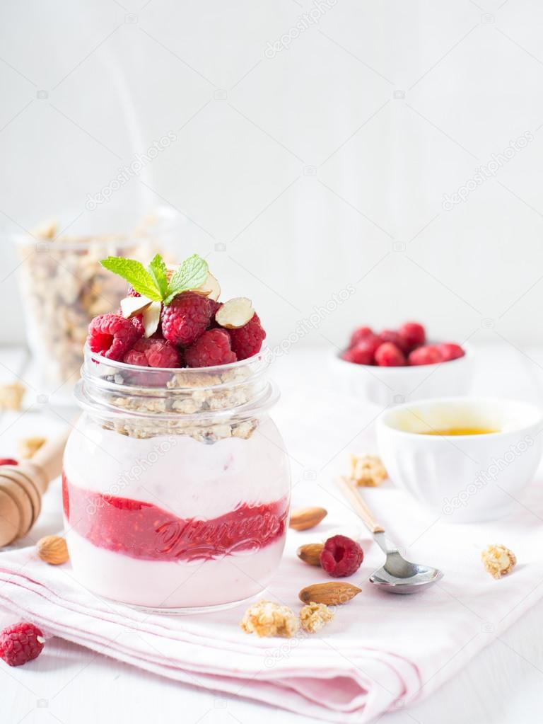 Yogurt with granola and raspberries