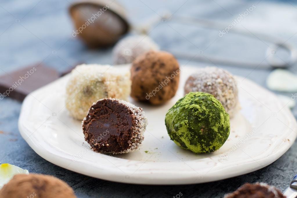 Chocolate truffles on white dish