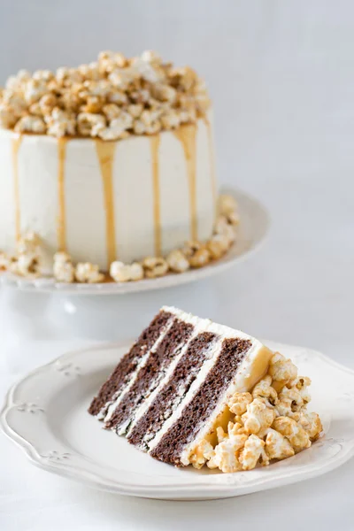 Chocolate cake with caramel and popcorn — Stock Photo, Image