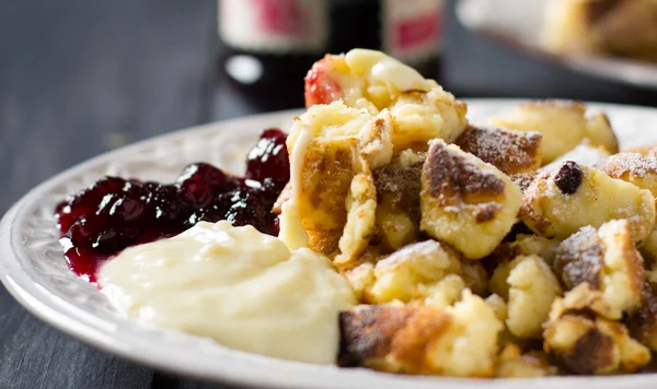 Kaiserschmarrn with vanilla and cranberry sauces — Stock Photo, Image