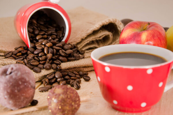Healthy homemade granola or muesli with oats, dried pears, raisin, almonds, hazelnuts and honey in a red bowl for breakfast
