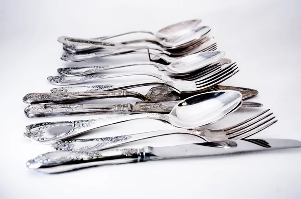 Tenedor, cuchara y cuchillo aislados en blanco . — Foto de Stock