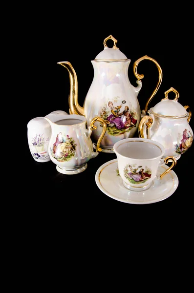 Tea service on black background — Stock Photo, Image