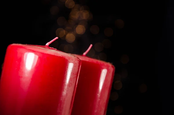 Red candle with fire against defocused lights — Stock Photo, Image