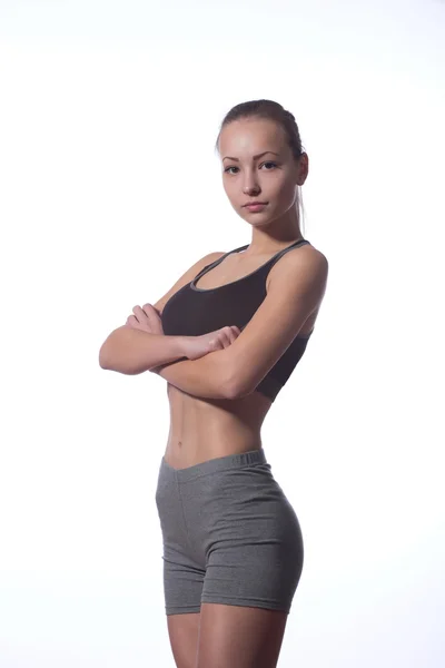 Fitness-Frau im Sportstil vor weißem Hintergrund — Stockfoto