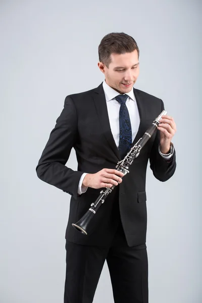 Young man playing the clarinet — Stock Photo, Image