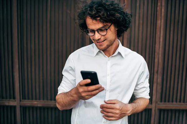 Closeup Happy Businessman White Shirt Transparent Eyeglasses Messaging Mobile Phone — Stock Photo, Image