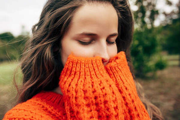 Closeup Portrait Young Woman Enjoys Weather Closed Eyes Wearing Orange Stock Picture
