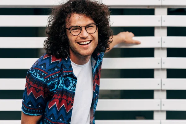 Positive Young Man Curly Hair Smiling Looking Camera Posing City — Stock Photo, Image