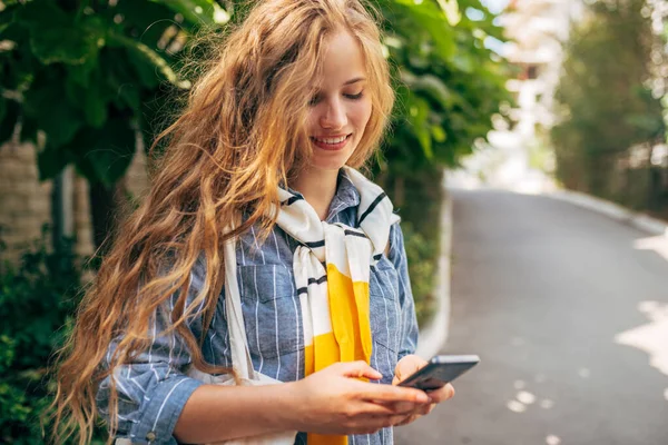 Horizontal Image Pretty Female Blue Shirt Pullover Shoulders Messaging Mobile Royalty Free Stock Photos