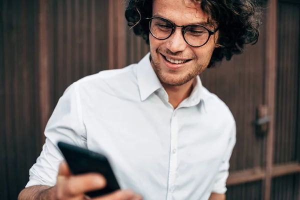 Closeup Happy Businessman White Shirt Transparent Eyeglasses Messaging Mobile Phone — Stock Photo, Image