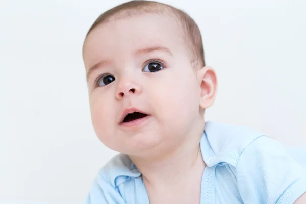 Adorable portrait de bébé regarder d'un côté sur fond blanc — Photo