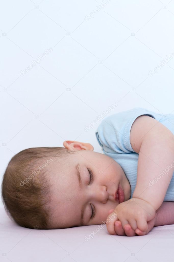 Adorable and beautiful sleeping baby on white background
