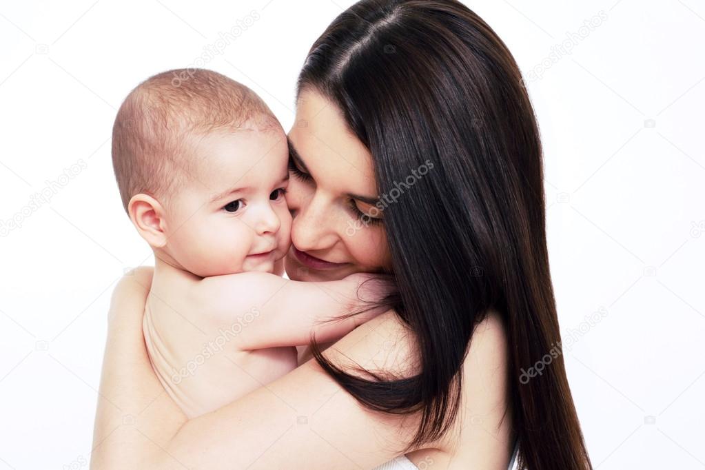 Beautiful mom holding baby on white background