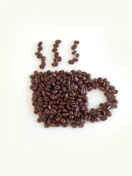 Kahve çekirdeği beyaz arka plan üzerinde kahverengi kurutulmuş — Stok fotoğraf