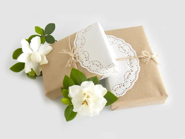 Box gift with beautiful white gardenia flower on white background — Stock Photo, Image
