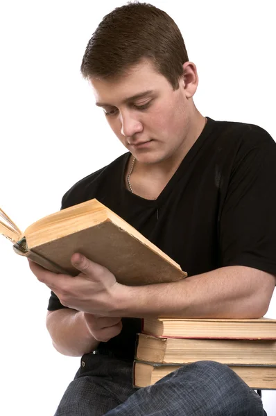 Young man reading a book — Stock Photo, Image