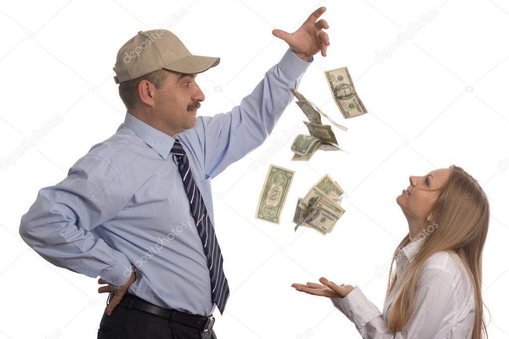 Man throws dollars that fly into the hands of a girl