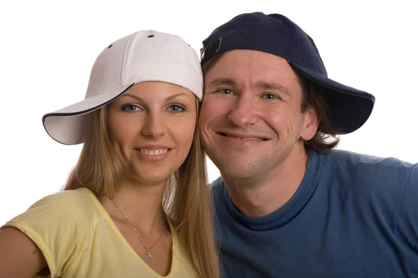 Happy couple in caps on the head — Stock Photo, Image