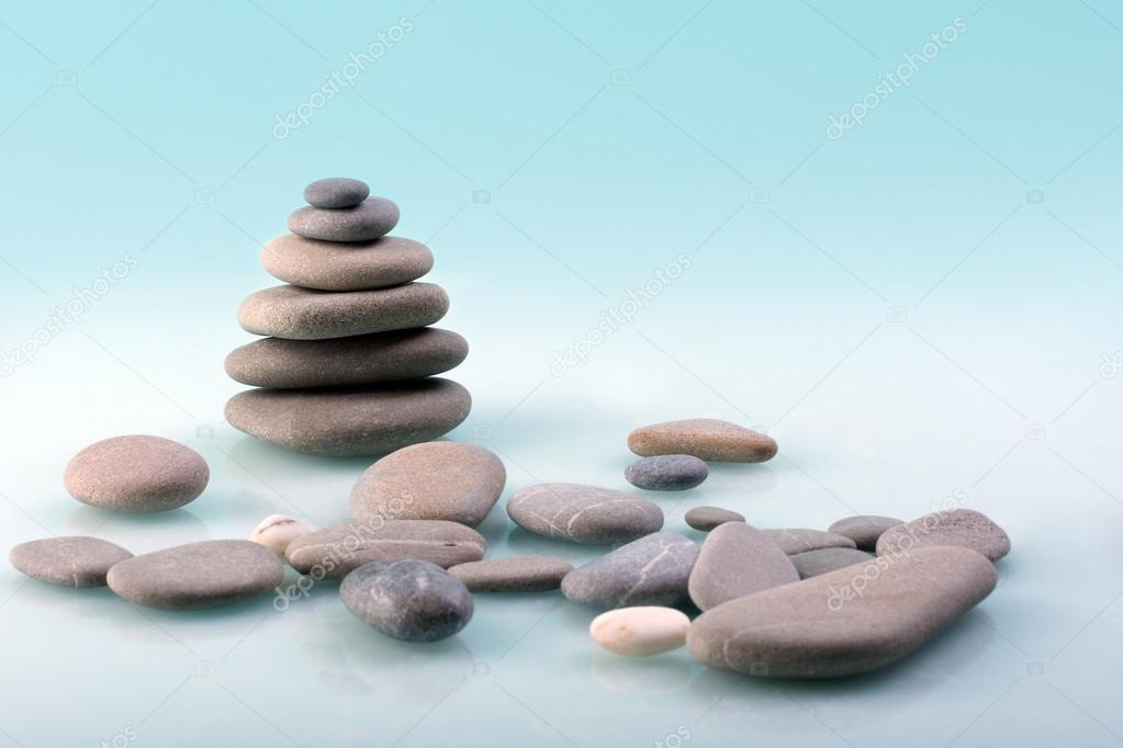 Stone pyramid on a turquoise background