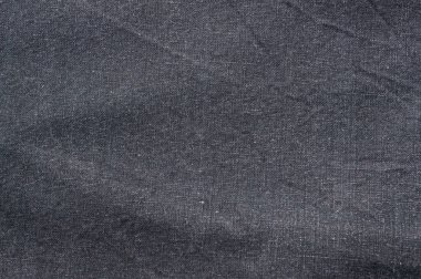 Bu kot tekstil kumaşın eşsiz özelliklerini ve rengini vurgulayan dokuma malzemesinin ayrıntılı bir görünümünü sergiliyor.