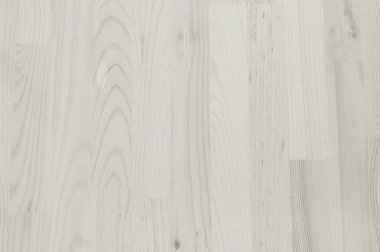 Bu resim, açık renkli ahşap döşeme, doğal tahıl ve dokuyu vurgulayan yakın çekim görüntülerini sergiliyor.