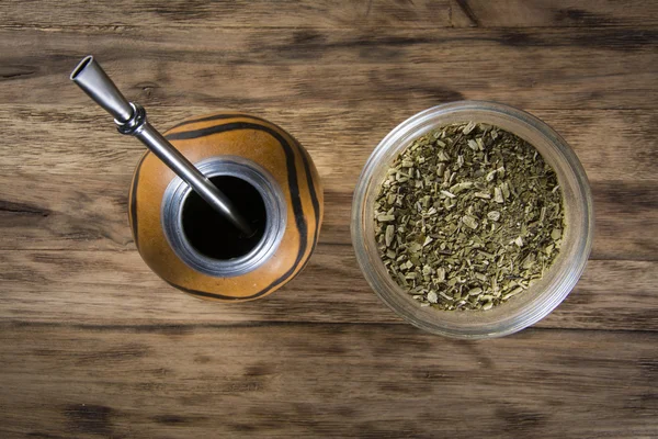 Yerba mate cup on wooden table — Stock Photo, Image