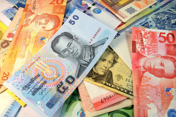 Close up of  Various currency notes and coins from different countries