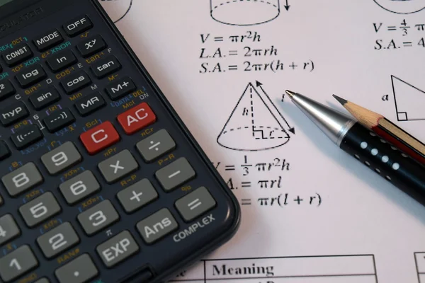 Eye Glasses, pen and pencil over the Formula with calculator — Stock Photo, Image