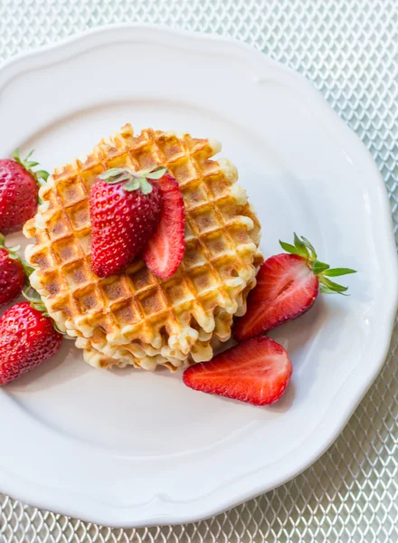 Belgian waffles with strawbery on white plate — Stock Photo, Image
