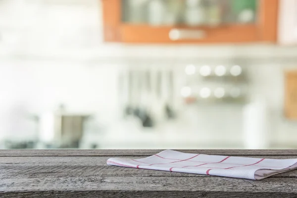 Blurred background. Modern kitchen with tabletop and space for you.