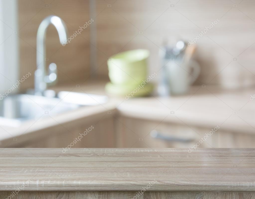 Blurred background. Modern kitchen with tabletop and space for you