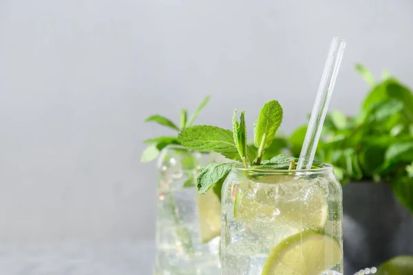 Mojito with, lime mint and ice cube on gray background. — Stock Photo, Image