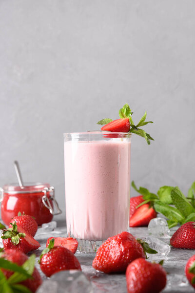 Indian strawberry lassi or milkshake on gray background