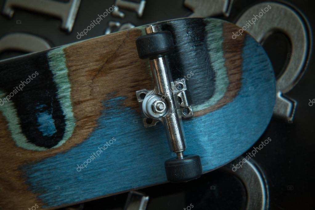 Front view of the back of a skate board with black wheels — Stock Photo © Svetlana_Cherruty