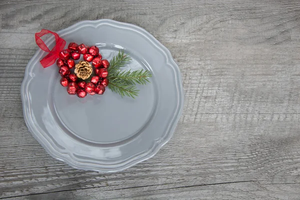 Christmas grey plate with christmas pine branches, decorations. Christmas holidays background.  Top view with copy space. — Stock Fotó