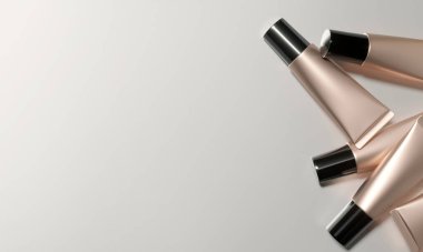 Tubes  - 3d render illustration. Blank face cream - Rose Gold tube, black cap. Cosmetics lie on light background. Advertising mockup with copy space. Set of trendy realistic skin or hair care cream.