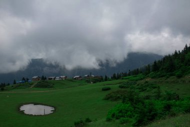 Aerial view of Badara Plateau and its traditional houses. Landscape photo was taken in summer. Pond and wonderful nature view on the plateau