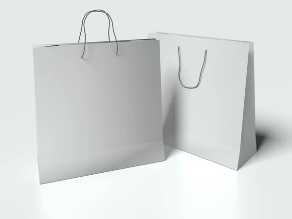 Beyaz arka plan üzerinde kulplu ışık gri kağıt torba. yukarı alay