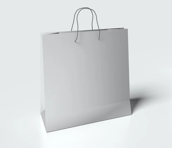Beyaz arka plan üzerinde kulplu ışık gri kağıt torba. yukarı alay