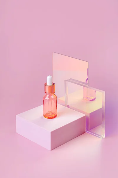 Serum in dropper bottle  on podium with gloss glass on pink background. Stylish background for presentation. Minimal style. Beauty product package, blank template