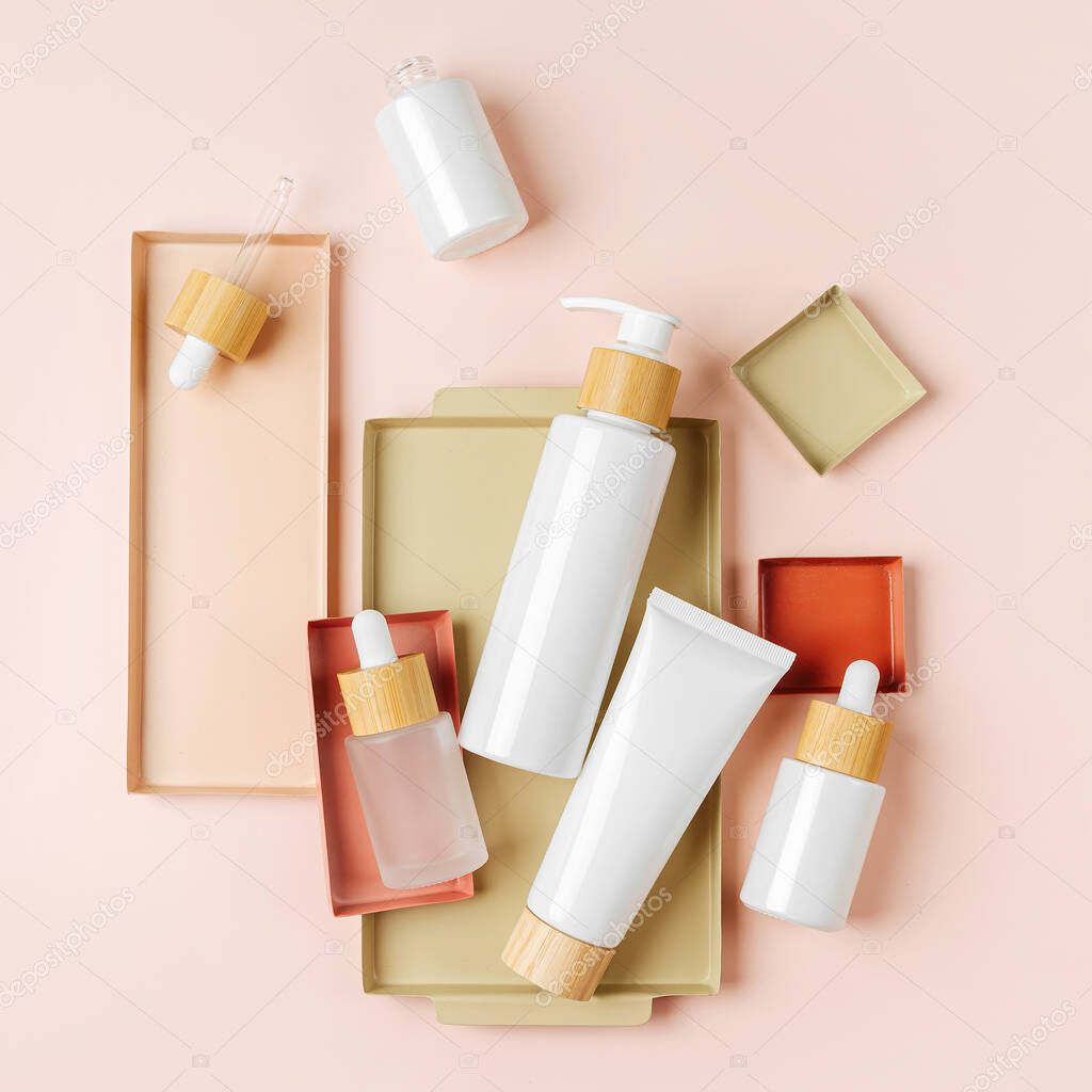 Various blank cosmetic container mock-ups on pastel color backgroun. Background for branding and packaging presentation. Natural skincare beauty product concep