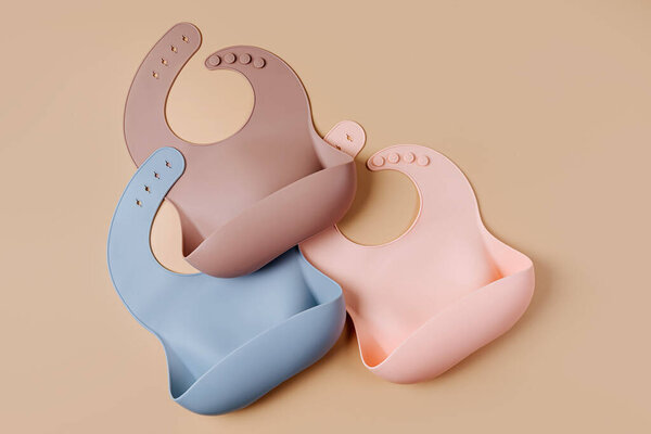 Set of silicone baby bibs. Nutrition and feeding concept. Top view, flat lay