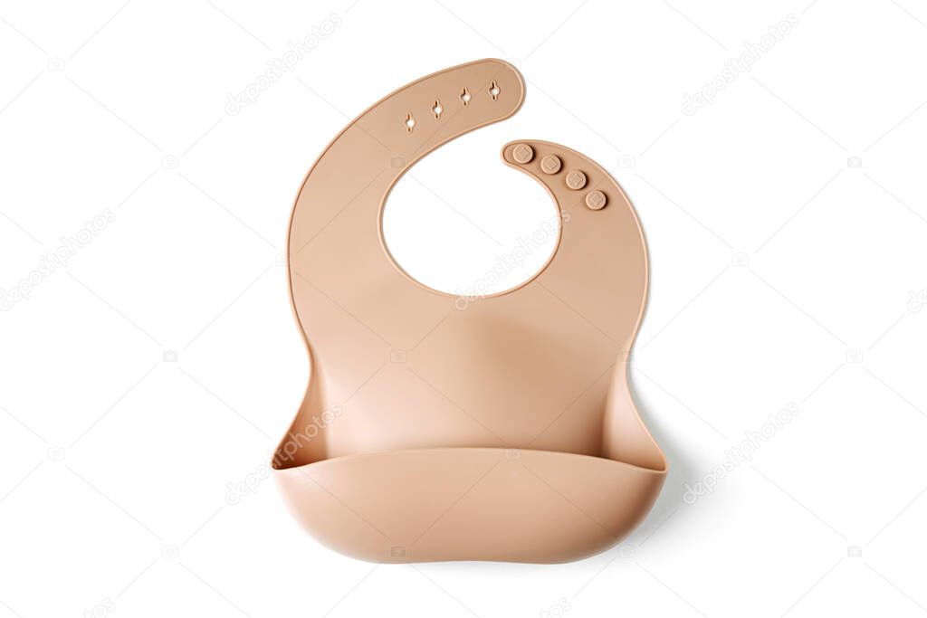 Brown silicone baby bib on white background. Top view, flat lay